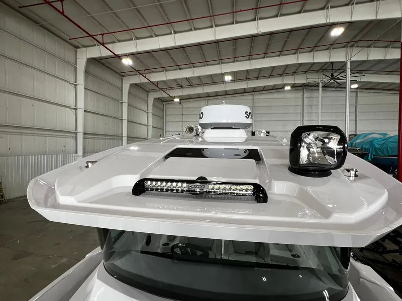 Slide: The Image of 2025 Axopar 29 CCX cabin interior with modern seating and sleek design. - 34