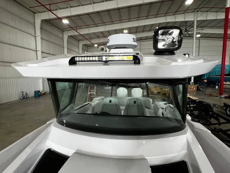 Slide: The Image of 2025 Axopar 29 CCX interior detail with textured surfaces and modern design elements. - 35