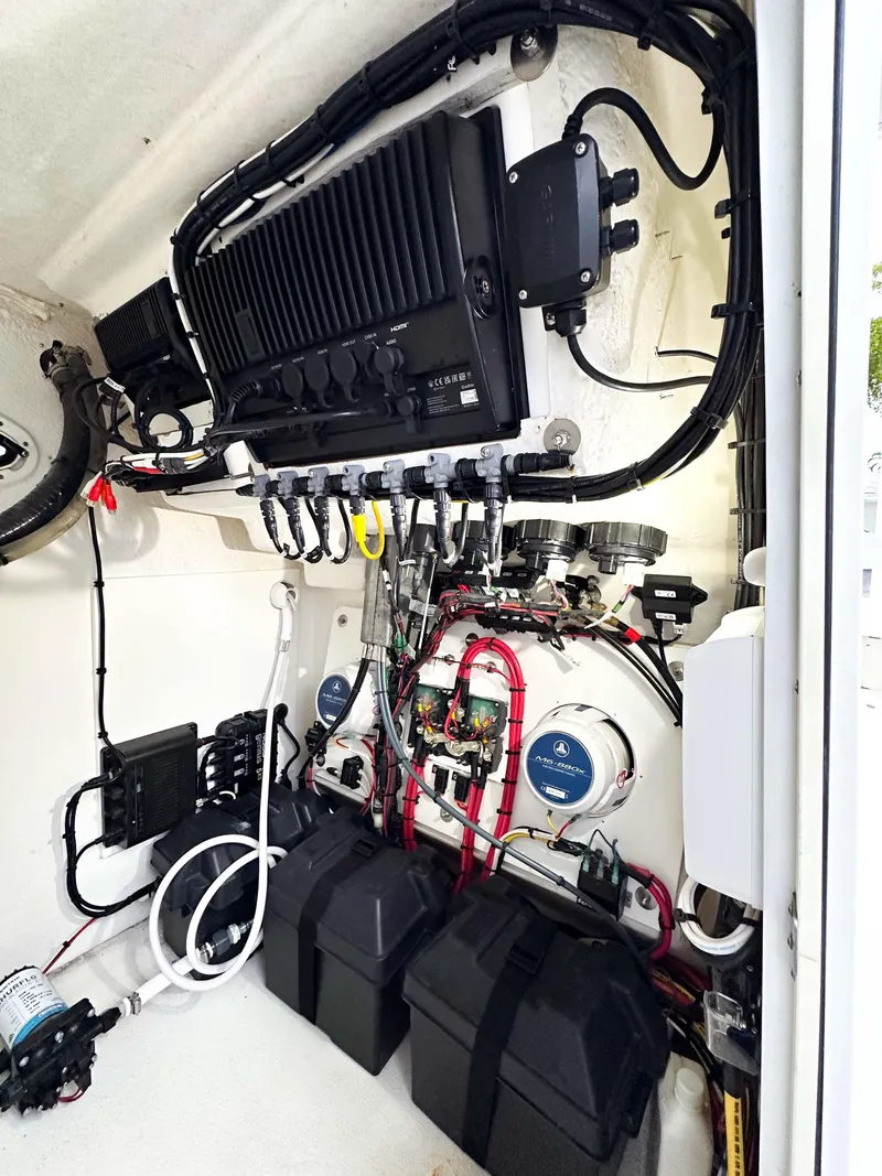 Slide: The Image of 2013 Twin Vee 26 Center Console boat electrical system with wiring and components. - 10