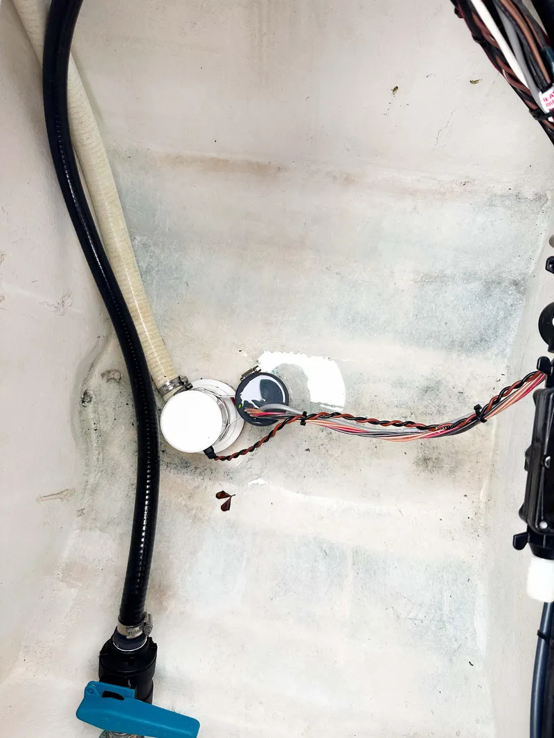 Slide: The Image of 2013 Twin Vee 26 Center Console boat wiring and plumbing details. - 18