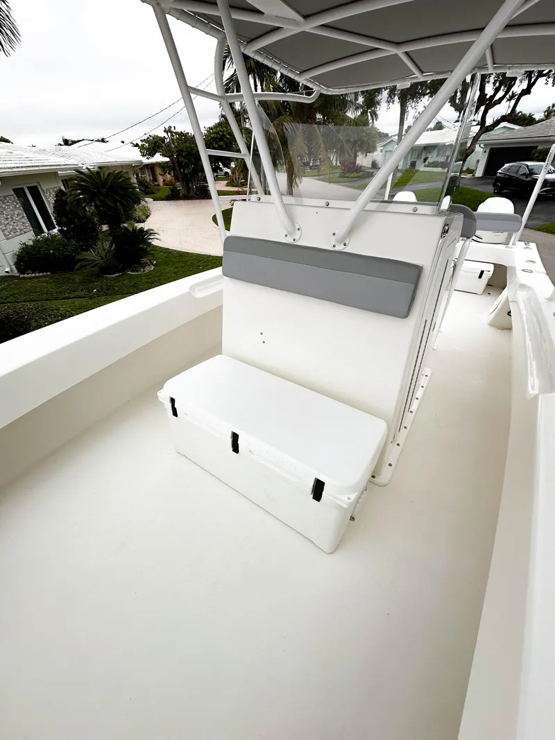 Slide: The Image of 2013 Twin Vee 26 Center Console boat interior with seating and storage. - 25