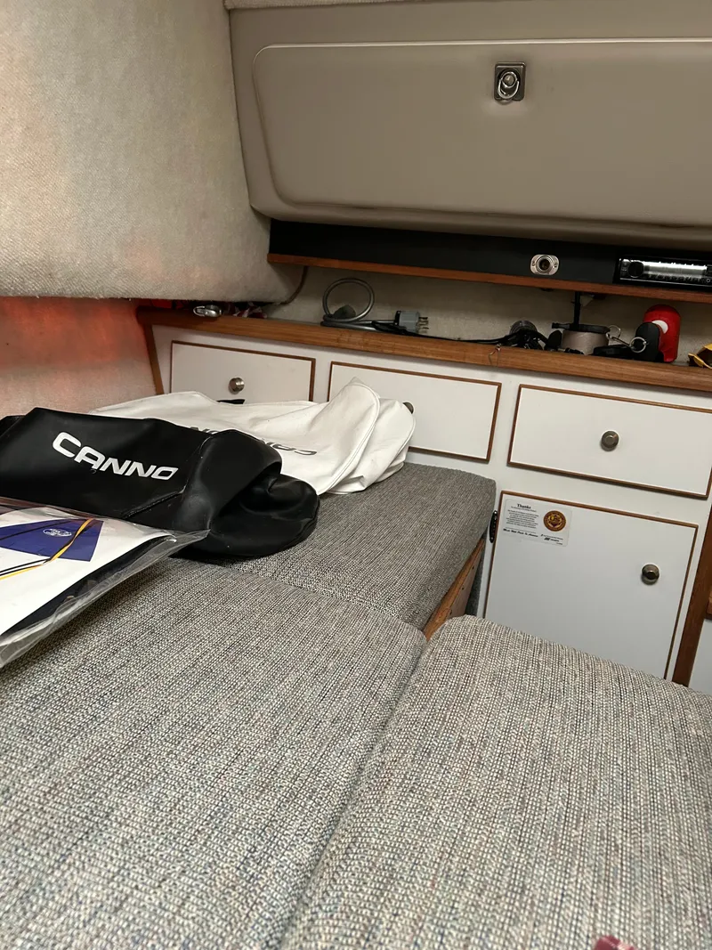 Slide: The Image of Interior cabin of a 1996 Trophy 2352 Walkaround boat with storage and seating. - 22