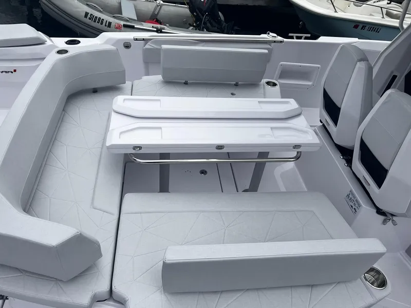 Slide: The Image of 2025 Axopar 29 CCX boat interior with sleek seating and modern design. - 10