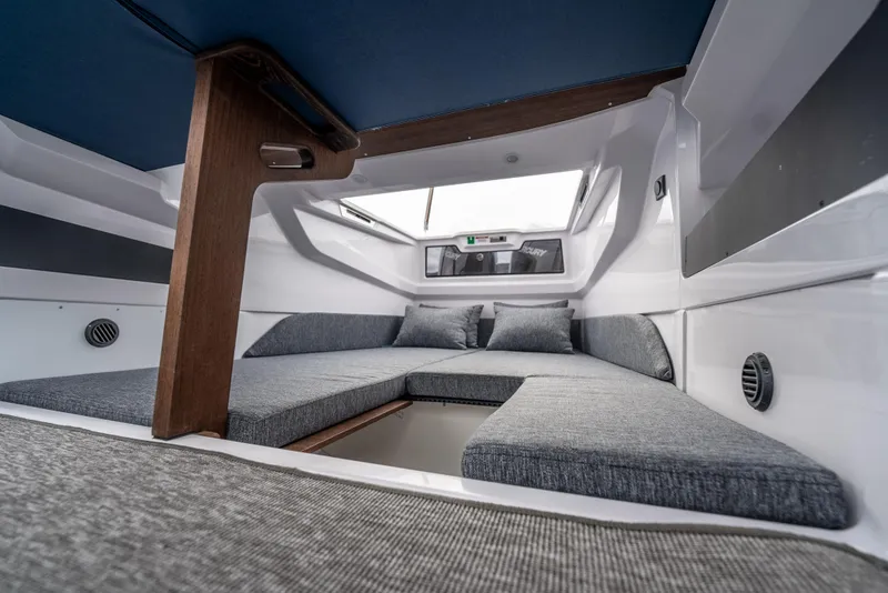Slide: The Image of 2025 Axopar 29 XC Cross Cabin interior with modern seating and sleek design. - 21