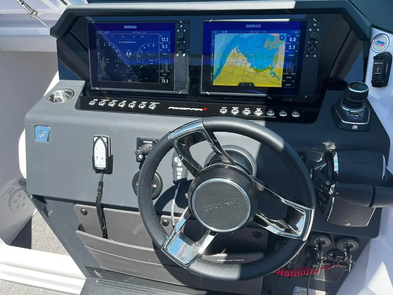 Slide: The Image of Control panel of 2025 Axopar 37 XC CROSS CABIN with dual Simrad displays. - 14
