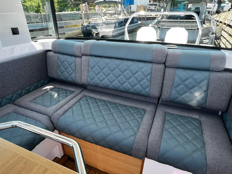 Slide: The Image of Luxurious seating in 2025 Axopar 37 XC CROSS CABIN with quilted upholstery. - 15