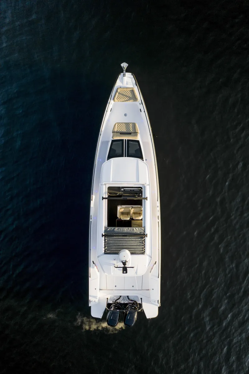 Slide: The Image of 2025 Axopar 37 XC Cross Cabin interior with modern bed and sleek design. - 16