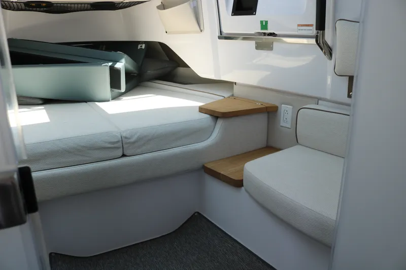 Slide: The Image of Interior cabin of 2025 Axopar 37 XC Cross Cabin with seating and storage. - 25