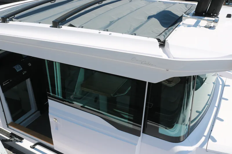 Slide: The Image of 2025 Axopar 37 XC Cross Cabin boat exterior with sleek design and modern features. - 4