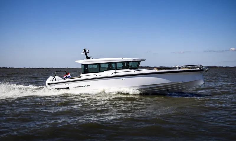 Slide: The Image of 2025 Axopar 37 XC Cross Cabin boat interior with modern design and sleek features. - 5