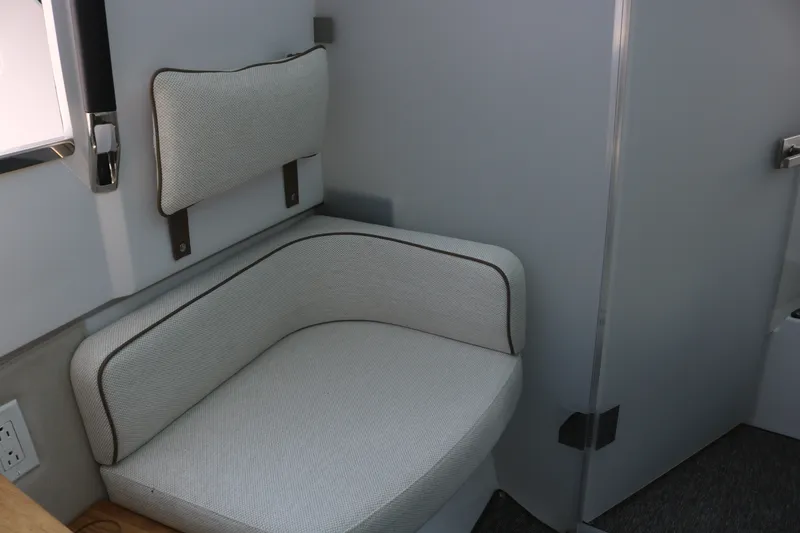Slide: The Image of 2025 Axopar 37 XC Cross Cabin interior seating with modern design and comfortable upholstery. - 21