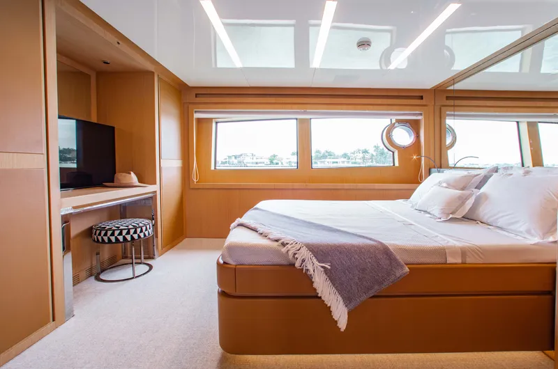 Slide: The Image of Luxurious bedroom interior of 2016 Riva 88' Florida yacht with modern decor. - 11