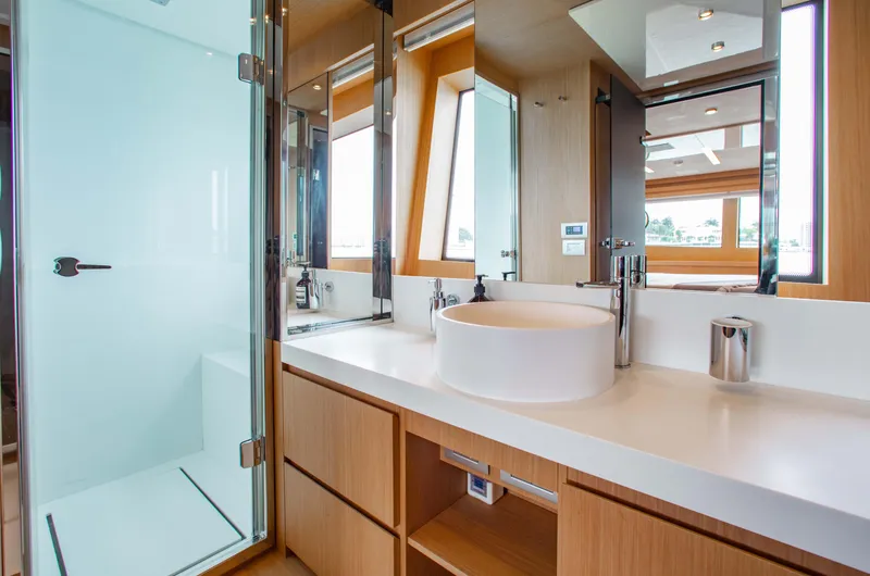 Slide: The Image of Luxurious bathroom interior on 2016 Riva 88' Florida yacht, featuring modern fixtures and elegant design. - 12