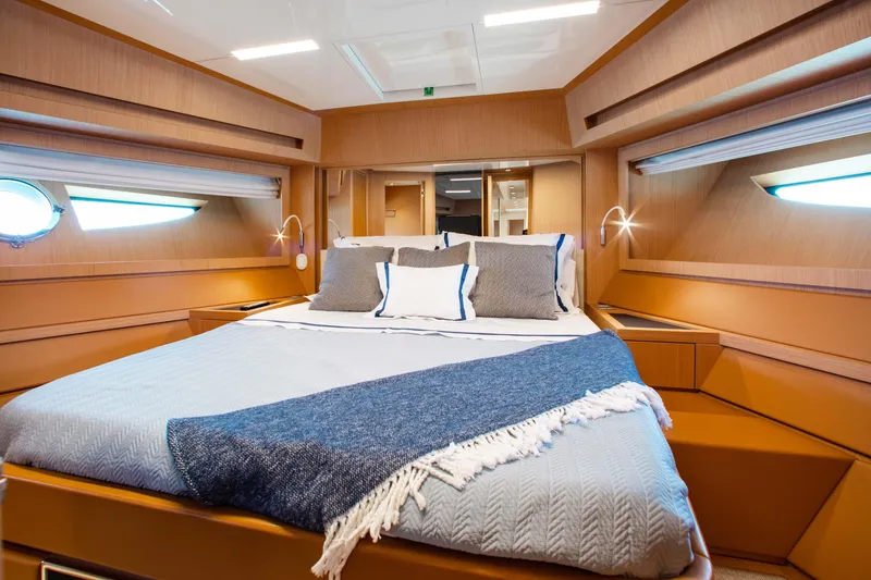 Slide: The Image of Luxurious cabin interior of 2016 Riva 88' Florida yacht with elegant bedding. - 21
