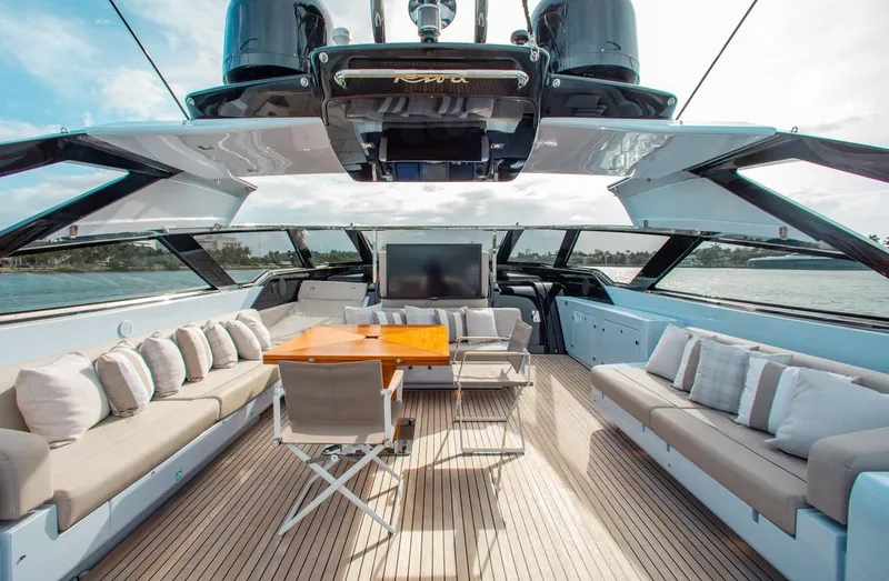 Slide: The Image of Luxurious 2016 Riva 88' Florida yacht interior with elegant seating and wooden table. - 27