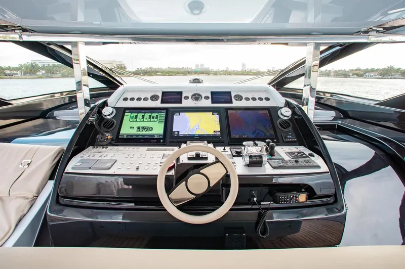 Slide: The Image of Cockpit of 2016 Riva 88' Florida yacht with advanced navigation systems and controls. - 30