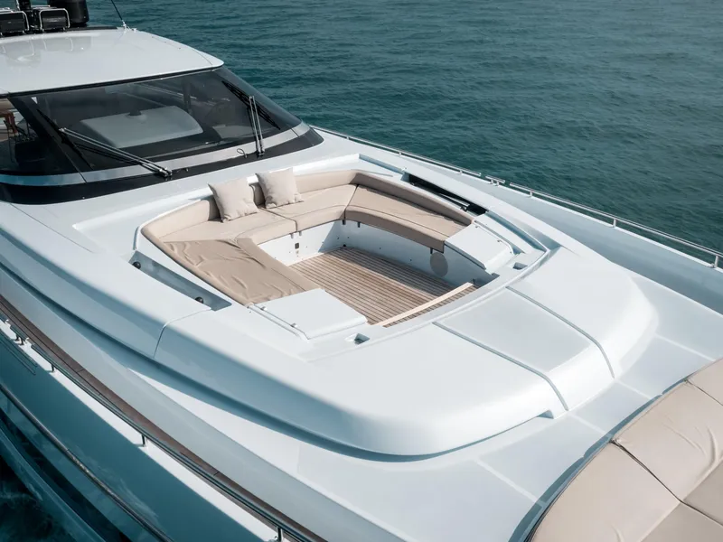 Slide: The Image of Luxurious 2016 Riva 88' Florida yacht with elegant deck seating on calm waters. - 33