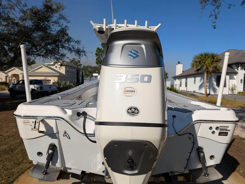 Slide: The Image of 2020 Blue Wave 2800 Makaira boat with Suzuki 350 engine, parked outdoors. - 10