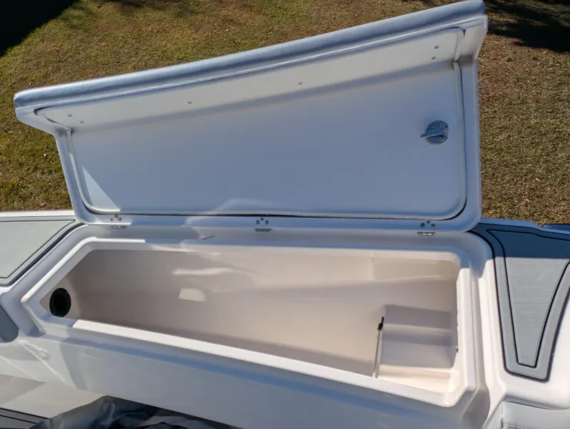 Slide: The Image of Open storage compartment on 2020 Blue Wave 2800 Makaira boat. - 14