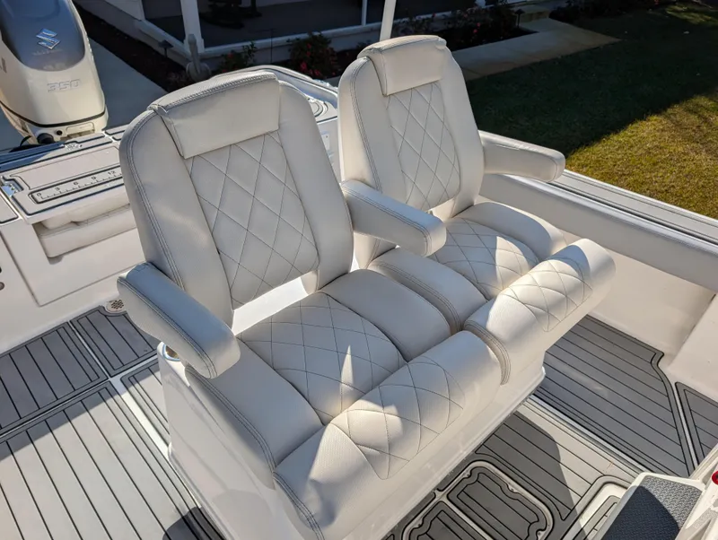 Slide: The Image of 2020 Blue Wave 2800 Makaira boat seats with diamond stitching and armrests. - 25