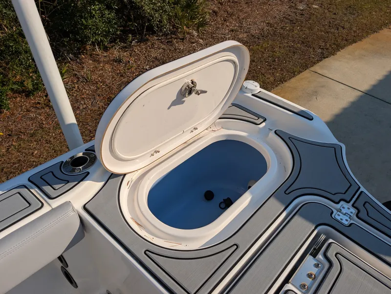 Slide: The Image of Open storage compartment on 2020 Blue Wave 2800 Makaira boat, featuring sleek design and functionality. - 32