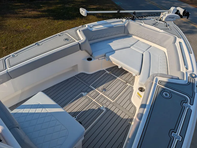 Slide: The Image of 2020 Blue Wave 2800 Makaira boat interior with cushioned seating and deck. - 39