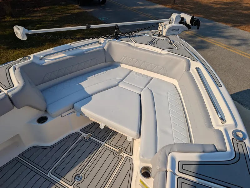 Slide: The Image of 2020 Blue Wave 2800 Makaira boat with cushioned seating and trolling motor. - 41