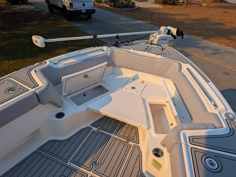 Slide: The Image of 2020 Blue Wave 2800 Makaira boat deck with storage compartments and trolling motor. - 43