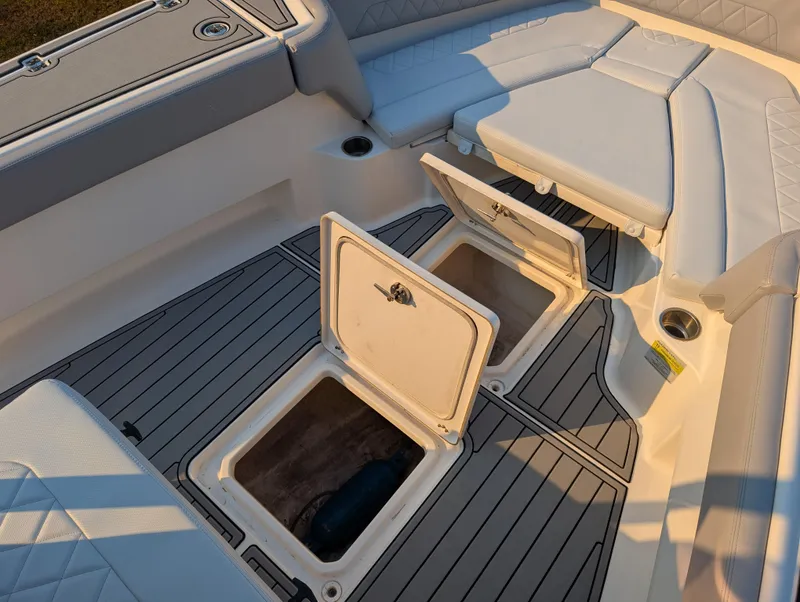 Slide: The Image of 2020 Blue Wave 2800 Makaira boat interior with open storage compartments. - 44