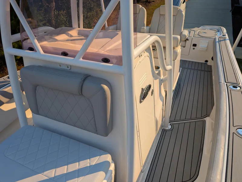 Slide: The Image of 2020 Blue Wave 2800 Makaira boat interior with cushioned seating and sleek design. - 45