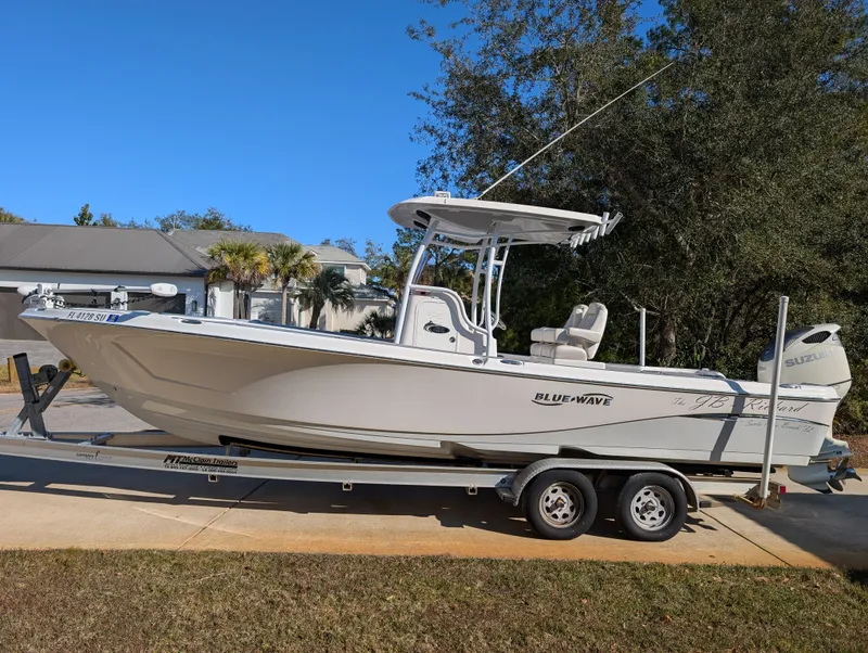 Slide: The Image of 2020 Blue Wave 2800 Makaira boat on trailer, parked outdoors. - 47