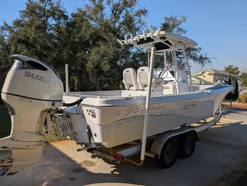 Slide: The Image of 2020 Blue Wave 2800 Makaira boat on trailer with Suzuki outboard motor. - 5