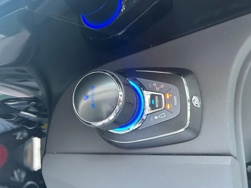 Slide: The Image of Control panel of 2025 Axopar 45 XC Cross Cabin with illuminated buttons. - 14