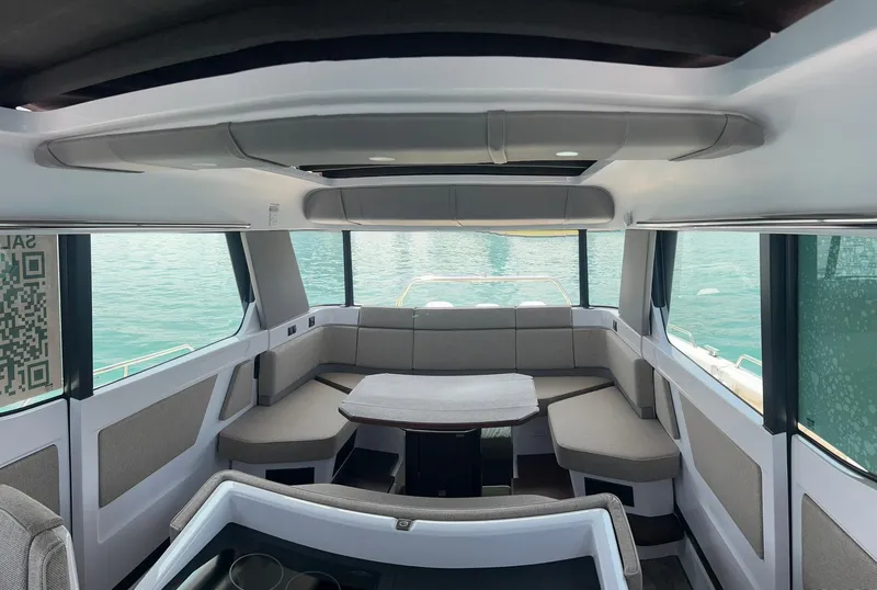 Slide: The Image of Interior of 2025 Axopar 45 XC Cross Cabin with panoramic windows and seating. - 17