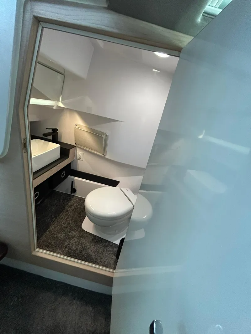Slide: The Image of Modern bathroom interior of 2025 Axopar 45 XC Cross Cabin boat. - 26