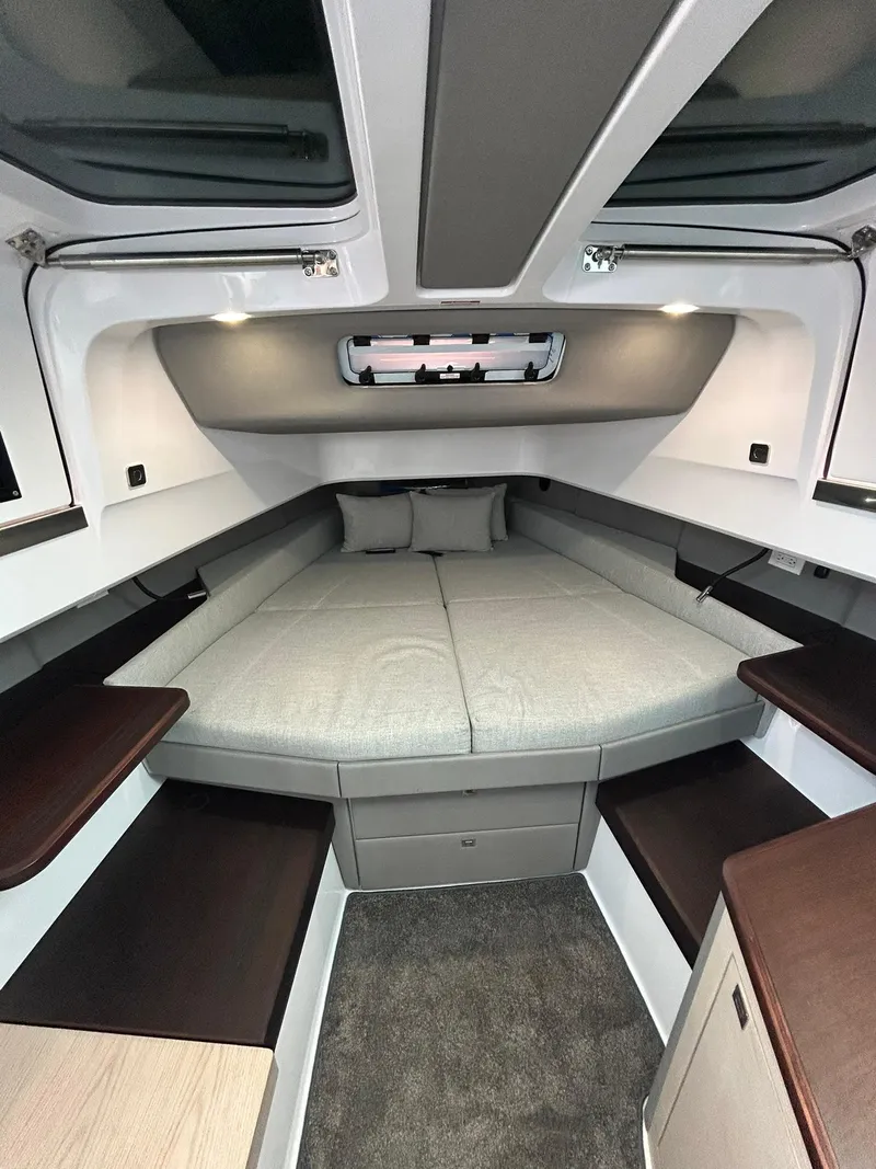 Slide: The Image of 2025 Axopar 45 XC Cross Cabin interior with modern bed and sleek design. - 32