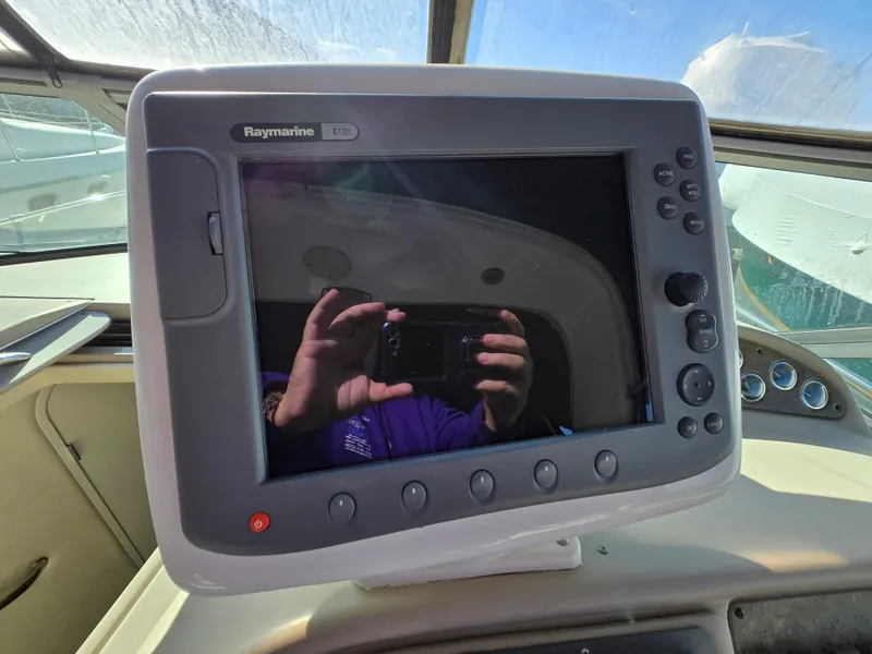Slide: The Image of Raymarine navigation system on 2000 Sea Ray 310 Sundancer boat dashboard. - 13