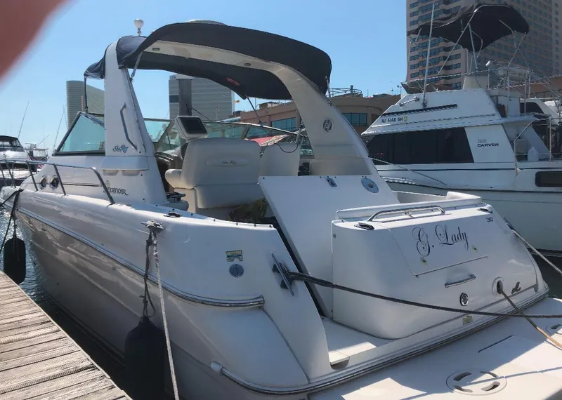 Slide: The Image of 2000 Sea Ray 310 Sundancer yacht docked at marina, rear view. - 37