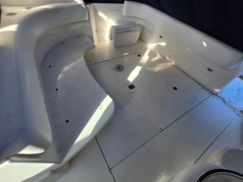 Slide: The Image of 2000 Sea Ray 310 Sundancer boat interior with spacious seating and clean deck. - 9