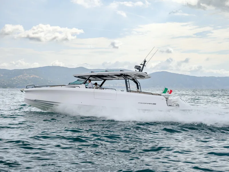 Slide: The Image of 2025 Axopar 45 SUN TOP cruising on open water, showcasing sleek design and performance. - 7