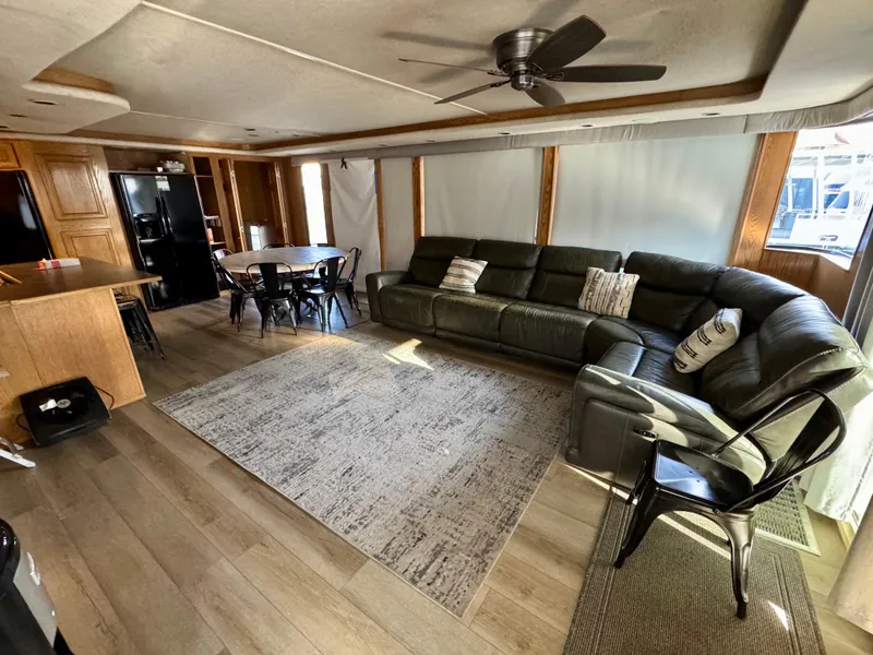 Slide: The Image of Spacious 1997 Sumerset Johnny Quest houseboat interior with modern furnishings and open layout. - 0