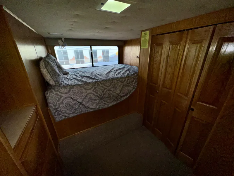Slide: The Image of 1997 Sumerset Johnny Quest Trip #33 interior with cozy bed and wooden cabinets. - 11