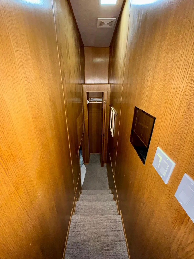 Slide: The Image of Narrow wooden staircase inside 1997 Sumerset Johnny Quest Trip #33 houseboat. - 12