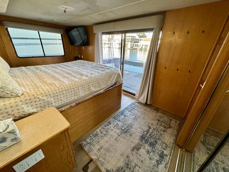 Slide: The Image of Cozy bedroom in 1997 Sumerset Johnny Quest Trip #33 houseboat with lake view. - 17