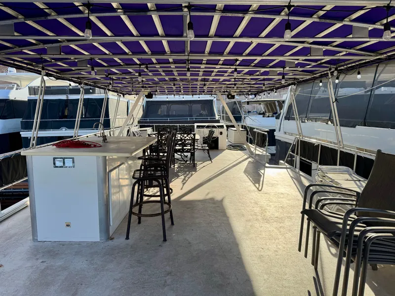 Slide: The Image of Upper deck of 1997 Sumerset Johnny Quest Trip #33 houseboat with bar and seating area. - 21