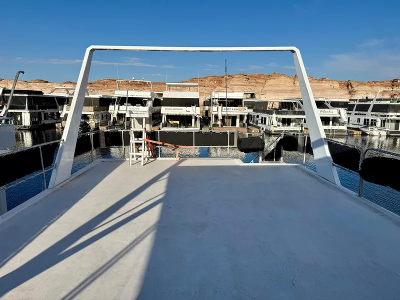 Slide: The Image of Rooftop deck of 1997 Sumerset Johnny Quest Trip #33 houseboat, docked with scenic background. - 22