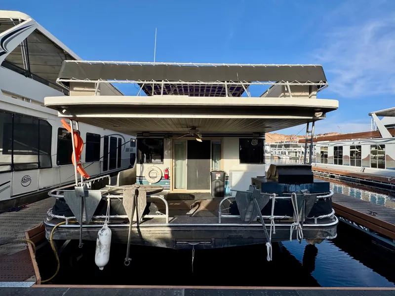 Slide: The Image of 1997 Sumerset Johnny Quest Trip #33 houseboat docked at marina, rear view. - 26
