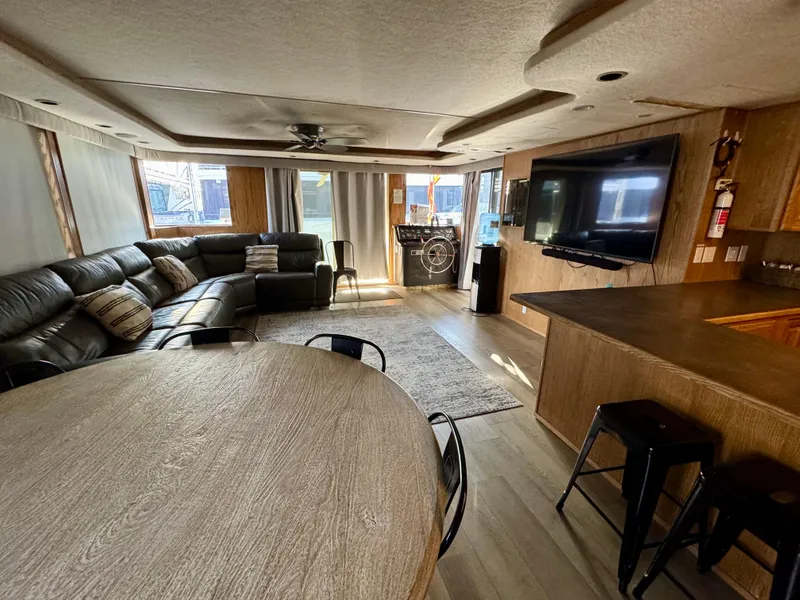 Slide: The Image of Spacious 1997 Sumerset Johnny Quest Trip #33 interior with modern furnishings and large TV. - 4