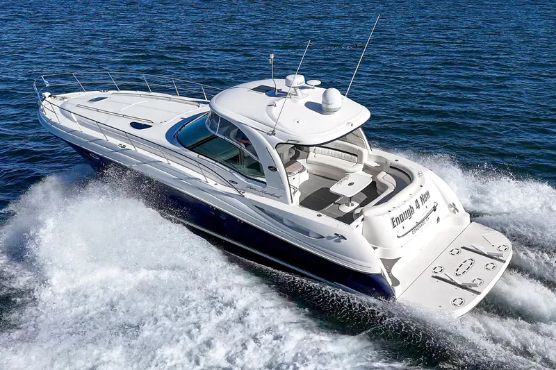 Slide: The Image of 2005 Sea Ray 500 Sundancer cruising on open water, showcasing sleek design and powerful performance. - 1