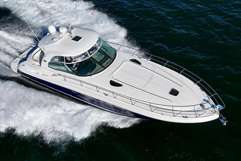 Slide: The Image of 2005 Sea Ray 500 Sundancer yacht cruising on open water. - 10